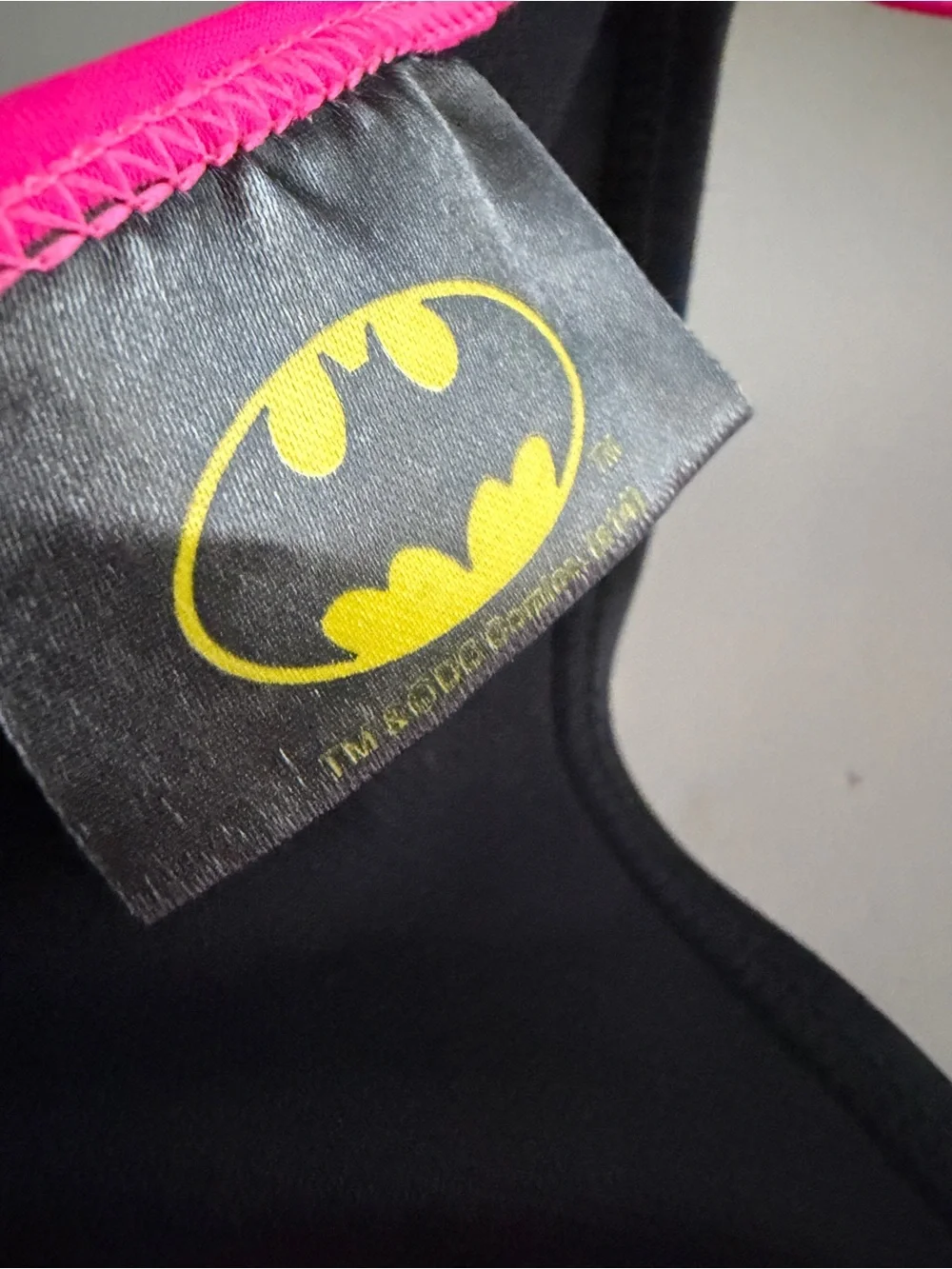 Girls Batman DC Comics Black & Neon Pink Triangle Swim Top with Holographic Logo